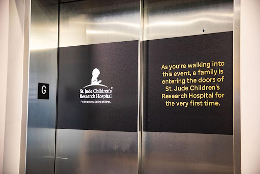 Large format signage used on elevator doors