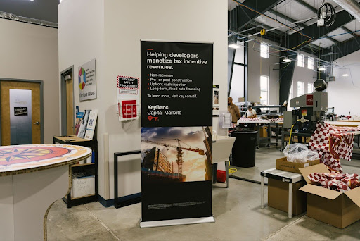 Retail signage printing of a large promotional banner display produced with commercial printing services